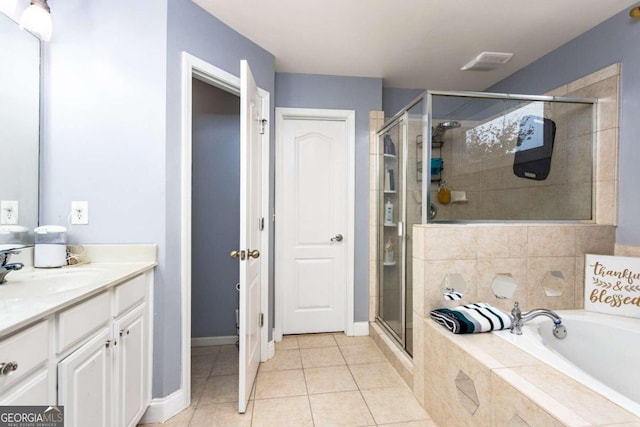 bathroom with independent shower and bath, vanity, and tile patterned floors