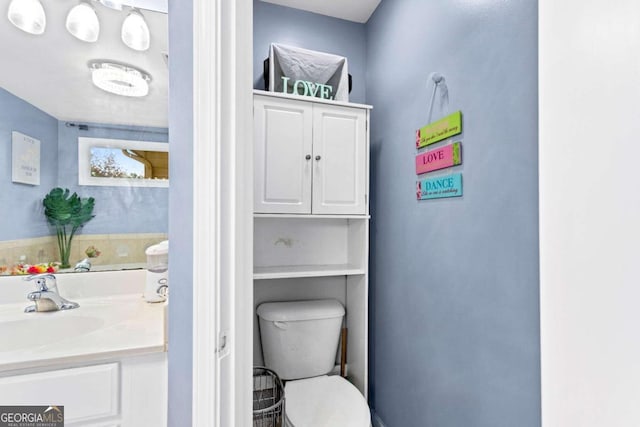 bathroom with vanity and toilet