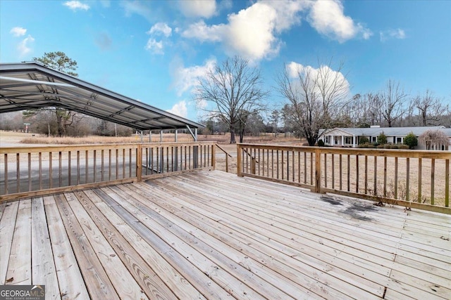 deck featuring a carport