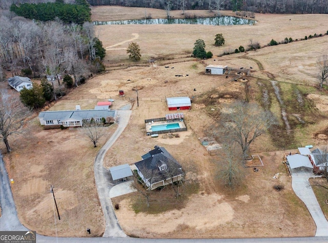 birds eye view of property with a rural view