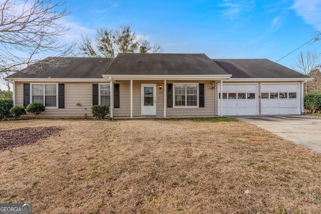 single story home featuring a garage and a front lawn