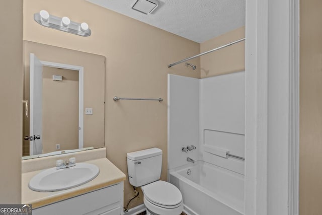 full bathroom with vanity, shower / bathtub combination, a textured ceiling, and toilet