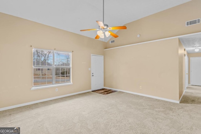 spare room with light carpet, high vaulted ceiling, and ceiling fan