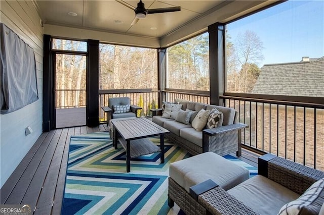 sunroom / solarium with plenty of natural light and ceiling fan