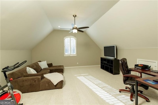 carpeted home office with lofted ceiling and ceiling fan