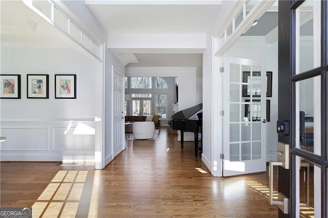 foyer entrance featuring dark wood-type flooring and french doors