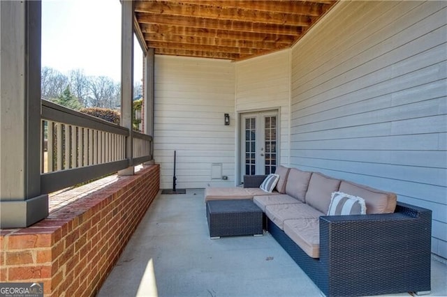 view of patio with french doors and an outdoor living space