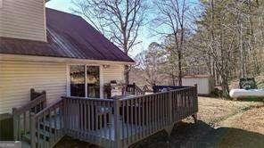 wooden terrace with a storage unit