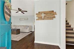 hall with dark wood-type flooring