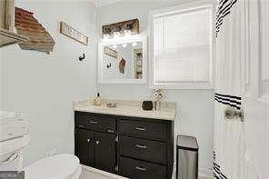 bathroom with vanity and toilet