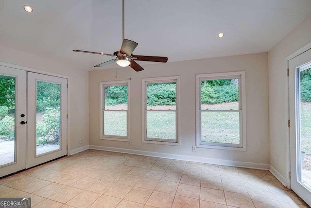 unfurnished sunroom featuring french doors and ceiling fan