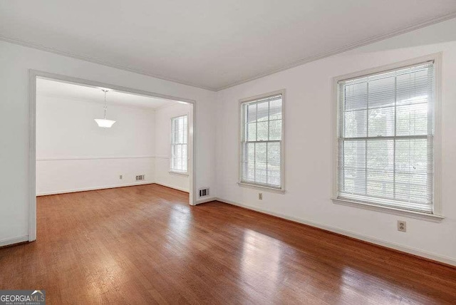 unfurnished room featuring hardwood / wood-style floors