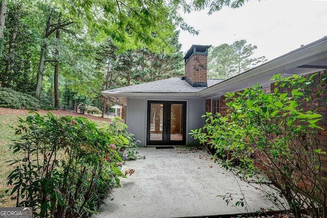 view of exterior entry featuring french doors