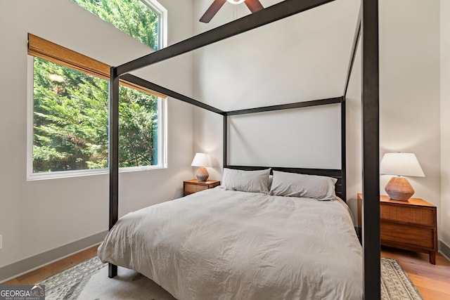 bedroom featuring ceiling fan and light hardwood / wood-style floors