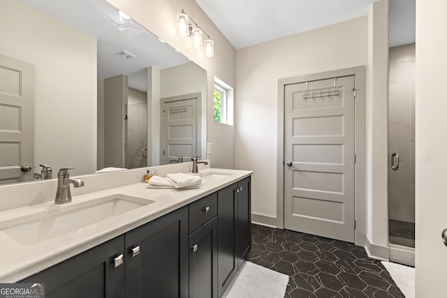 bathroom featuring tile patterned flooring, vanity, and an enclosed shower