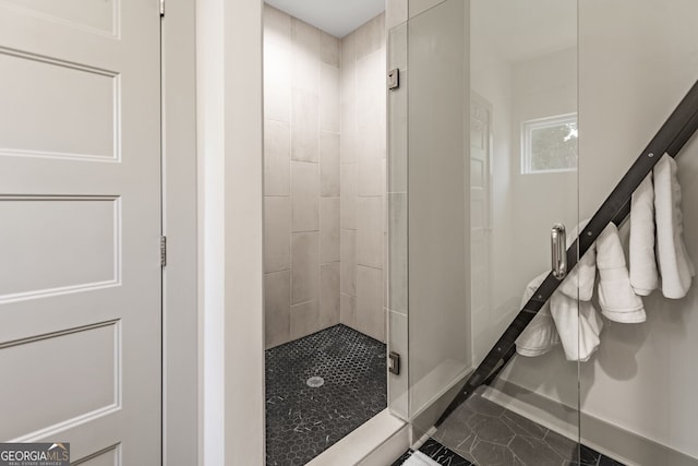 bathroom with walk in shower and tile patterned floors