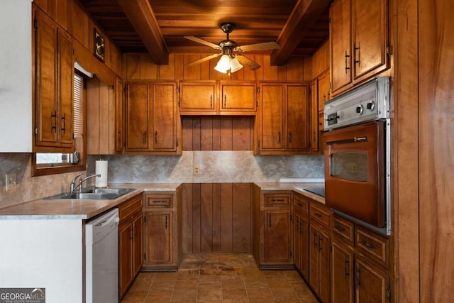 kitchen with sink, tasteful backsplash, white dishwasher, ceiling fan, and wall oven