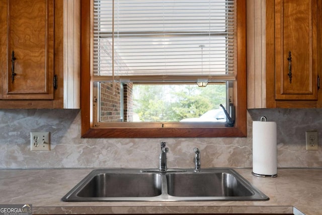 kitchen with tasteful backsplash and sink