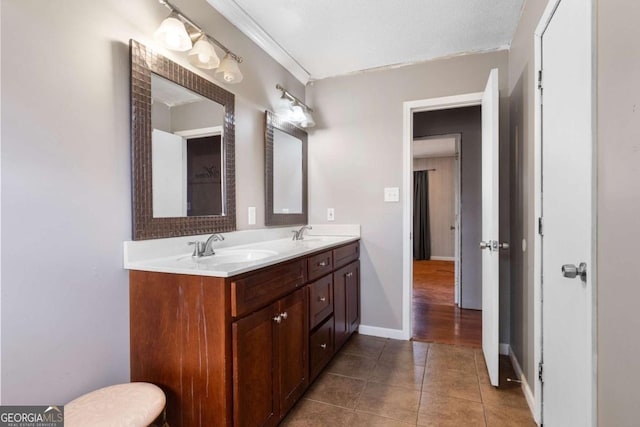 bathroom featuring tile patterned flooring and vanity