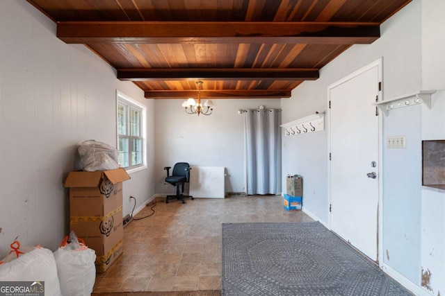 interior space featuring beam ceiling, a chandelier, and wood ceiling