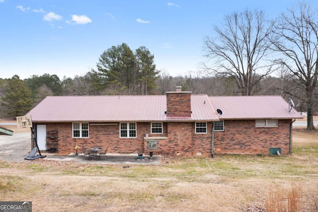 back of house with a patio