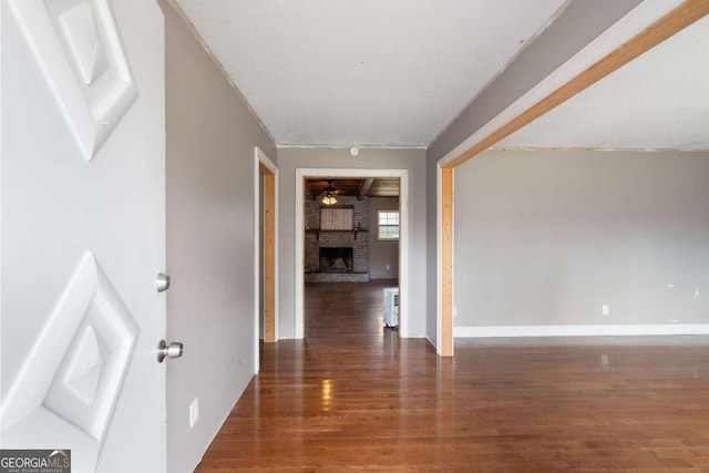 hallway with dark hardwood / wood-style floors