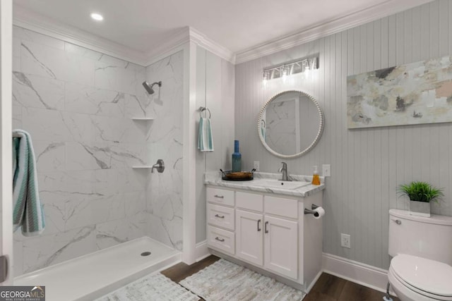 1471 River Rd, Townsend, GA 31331 - bathroom with toilet, ornamental molding, wood finished floors, a tile shower, and vanity