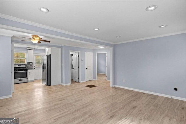 unfurnished living room with crown molding, ceiling fan, and light wood-type flooring