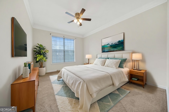 bedroom featuring light colored carpet, ornamental molding, and ceiling fan