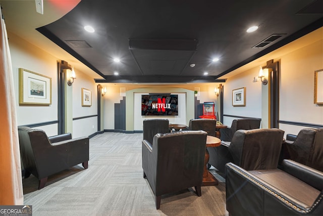 home theater featuring light colored carpet