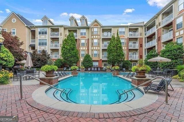 view of swimming pool with a patio area