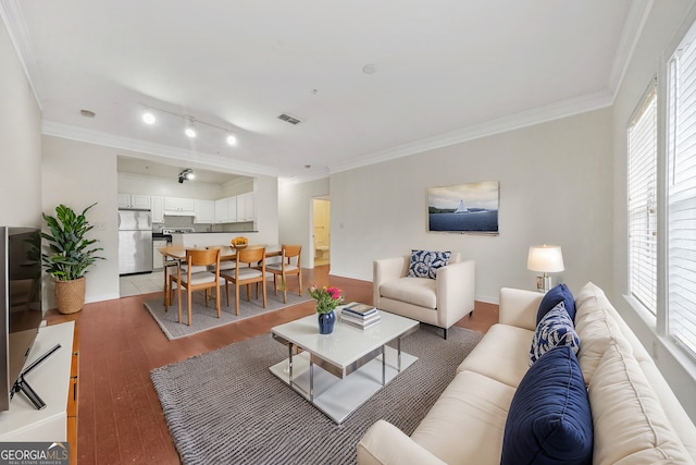 living room with crown molding and light wood-type flooring