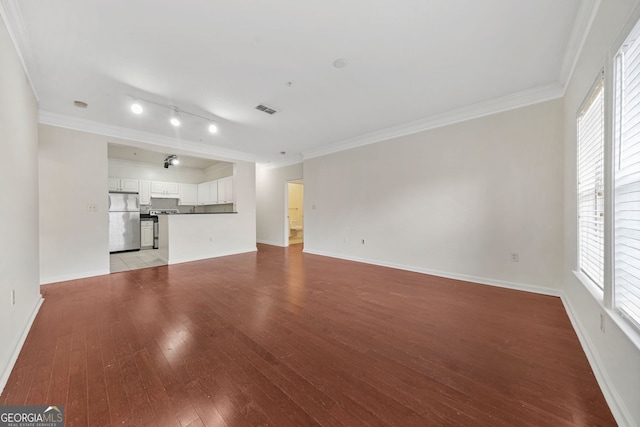 unfurnished living room featuring ornamental molding and light hardwood / wood-style flooring