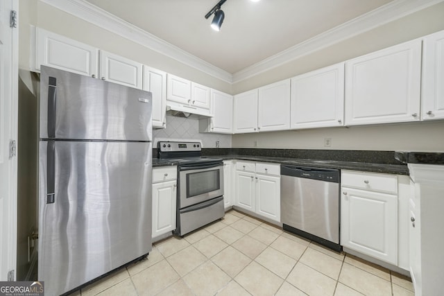 kitchen with crown molding, appliances with stainless steel finishes, tasteful backsplash, white cabinets, and light tile patterned flooring