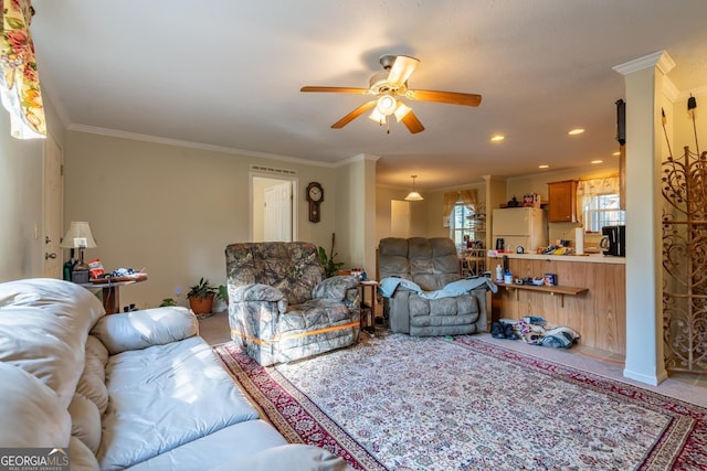 living room featuring crown molding and ceiling fan