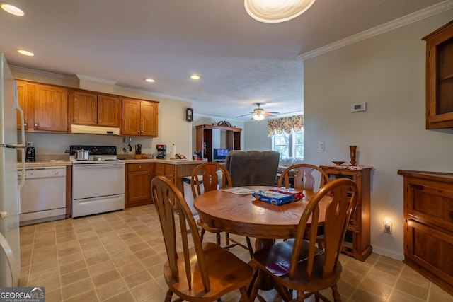 dining area featuring crown molding and ceiling fan