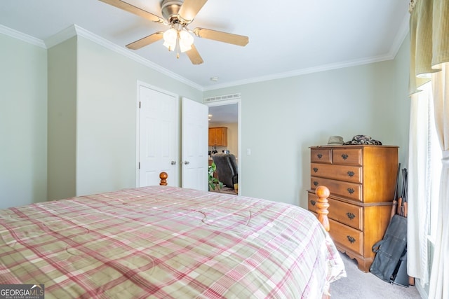 bedroom with crown molding, ceiling fan, and carpet