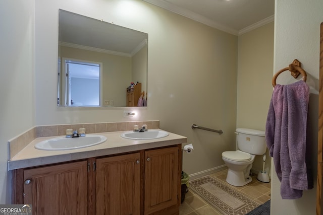 bathroom with vanity, tile patterned flooring, crown molding, and toilet