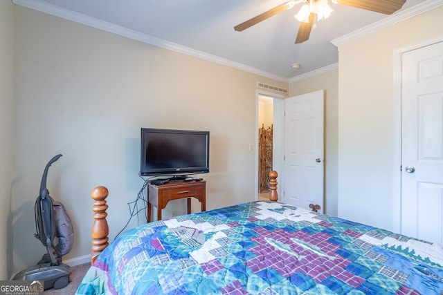 carpeted bedroom featuring crown molding and ceiling fan