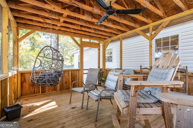 sunroom featuring ceiling fan