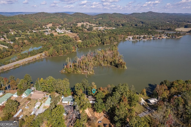 aerial view featuring a water and mountain view