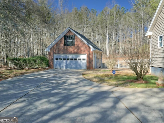 view of front of house featuring a garage and an outdoor structure