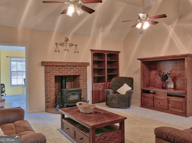 carpeted living room with lofted ceiling, ceiling fan, and a wood stove