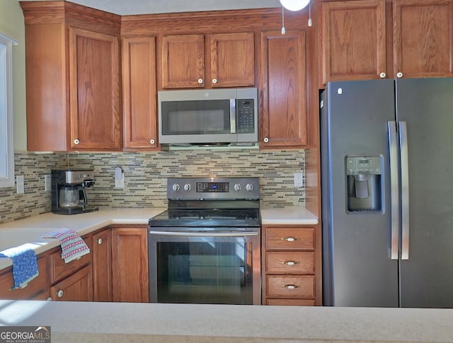 kitchen featuring backsplash and stainless steel appliances