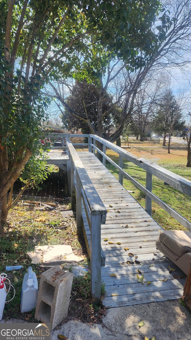 wooden deck featuring a rural view