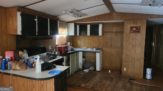 kitchen featuring dark hardwood / wood-style floors, lofted ceiling with beams, black range with gas cooktop, and wood walls