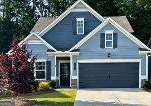 craftsman inspired home with a garage