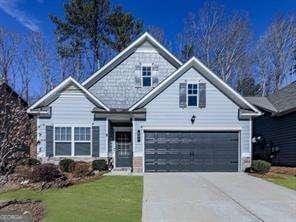 view of front of home featuring a garage and a front lawn