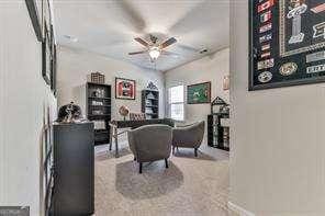 interior space featuring ceiling fan