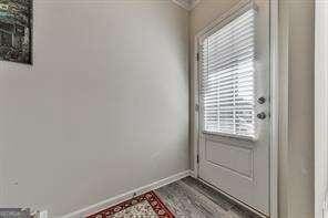 doorway to outside with hardwood / wood-style flooring